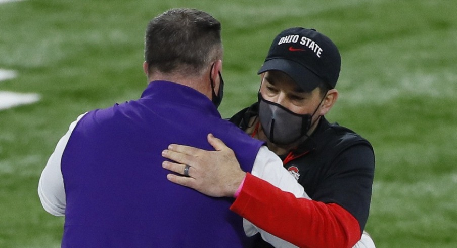 Northwestern Wildcats head coach Pat Fitzgerald hugs Ohio State Buckeyes head coach Ryan Day prior to the Big Ten Championship football game at Lucas Oil Stadium in Indianapolis on Saturday, Dec. 19, 2020. Big Ten Championship Ohio State Northwestern