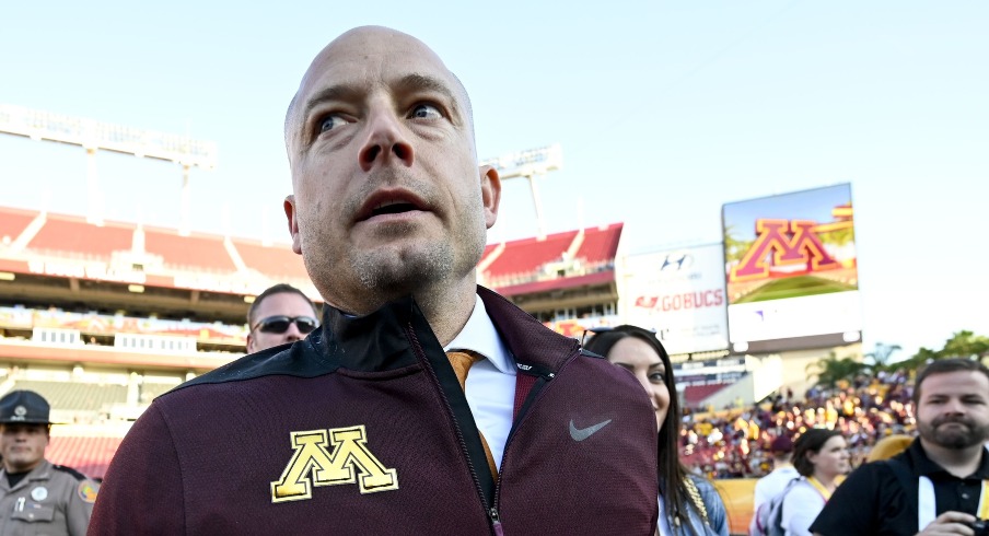 PJ Fleck (yellow tie) walks on the field after defeating the Auburn Tigers at Raymond James Stadium. Mandatory Credit: Douglas DeFelice-USA TODAY Sports