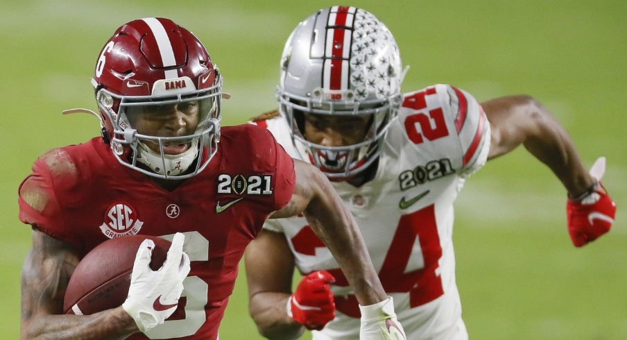 Jan. 11, 2021; Miami Gardens, Florida, USA; Alabama Crimson Tide wide receiver DeVonta Smith (6) runs upfield after catching a pass behind the defense of Ohio State Buckeyes cornerback Shaun Wade (24) during the second quarter of the College Football Playoff National Championship at Hard Rock Stadium in Miami Gardens, Fla. Mandatory Credit: Kyle Robertson/The Columbus Dispatch