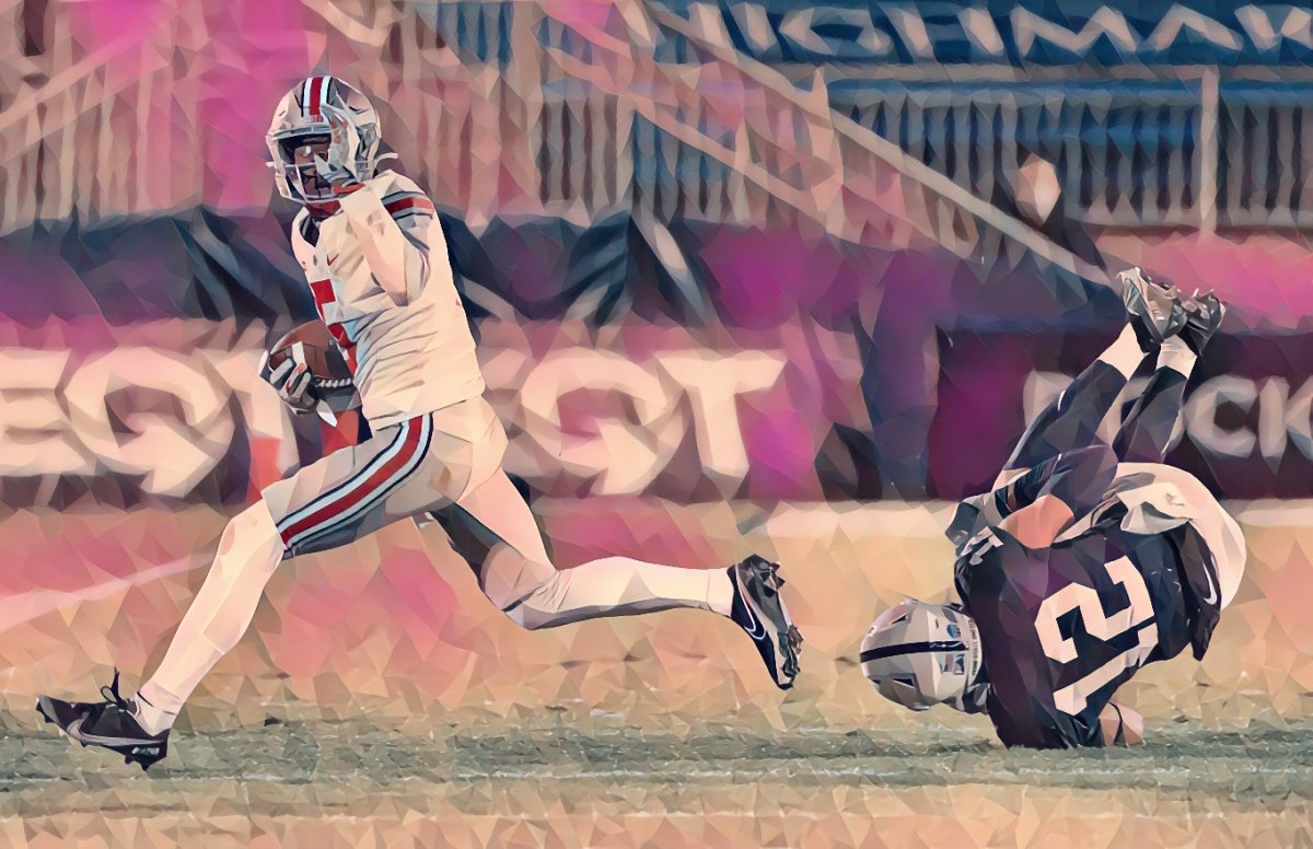 Ohio State Buckeyes wide receiver Garrett Wilson (5) runs past Penn State Nittany Lions linebacker Brandon Smith (12) after knocking him to the turf during the third quarter of a NCAA football game at Beaver Stadium in University Park, Pa. on Saturday, Oct. 31, 2020