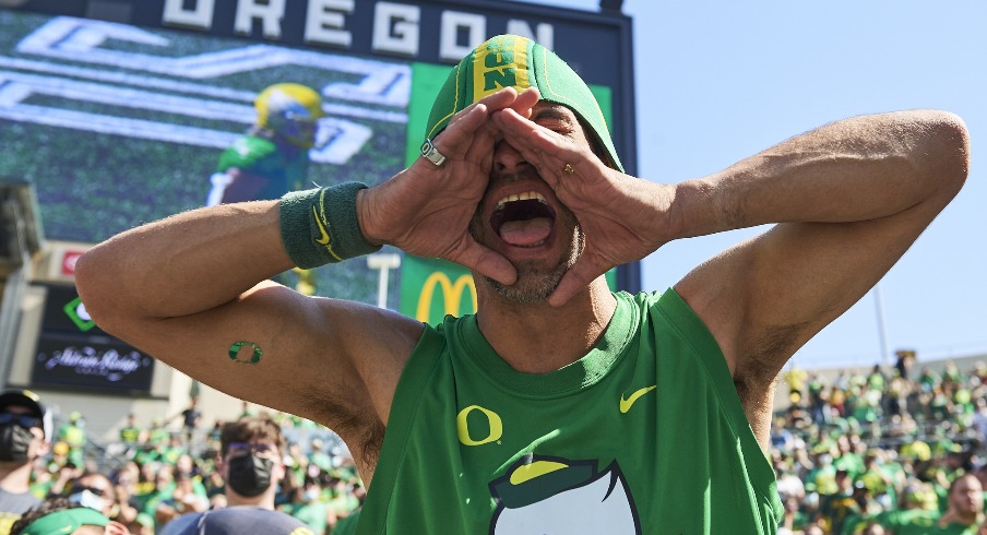 Sep 4, 2021; Eugene, Oregon, USA; An Oregon Ducks fan cheers during the second half against the Fresno State Bulldogs at Autzen Stadium. The Ducks won the game 31-24. Mandatory Credit: Troy Wayrynen-USA TODAY Sports