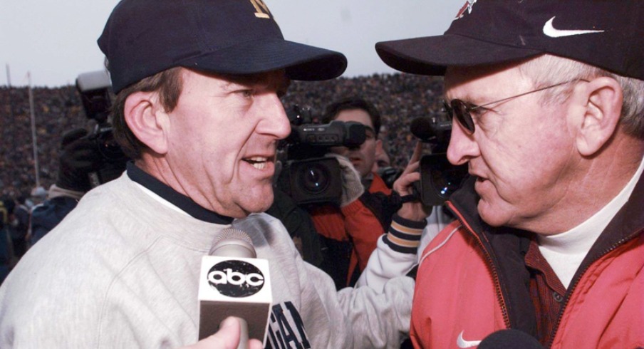 Michigan coach LOOYD CARR and OSU coach JOHN COOPER after UM's 20-14 win over Ohio State on Saturday, Nov 22, at Michigan Stadium. 