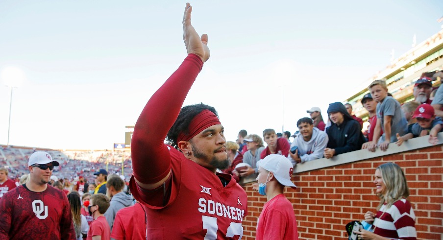 Quarterback Caleb Williams (13) waves to the crowd after a 52-21 win against Texas Tech on Oct. 30 at Gaylord Family-Oklahoma Memorial Stadium in Norman. cover main
