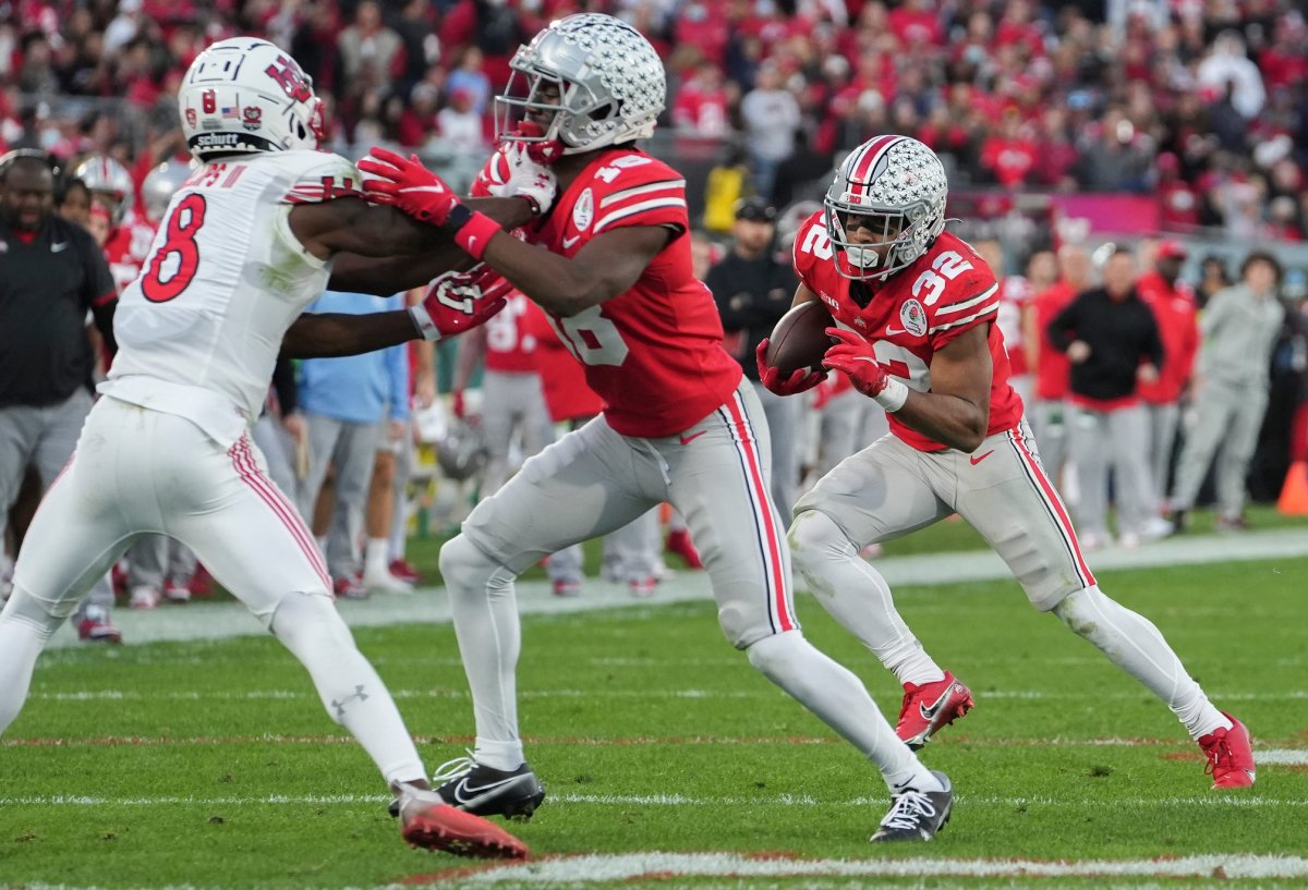 TreVeyon Henderson (32) runs the ball during the third quarter of the 108th Rose Bowl Game between the Ohio State Buckeyes and the Utah Utes at the Rose Bowl. Rose Bowl Game Ohio State Buckeyes Against Utah Utes