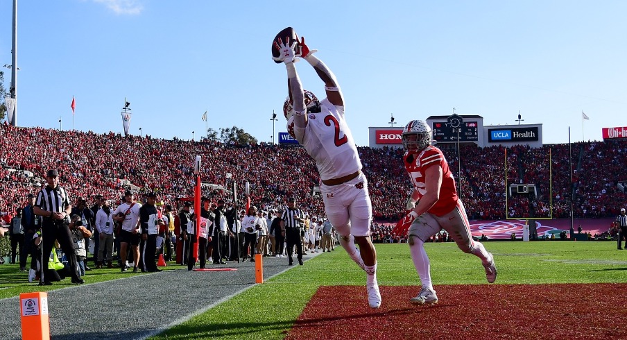 Utah Utes running back Micah Bernard (2) makes a catch for a touchdown against Ohio State Buckeyes linebacker Tommy Eichenberg (35)during the 2022 Rose Bowl college football game at the Rose Bowl. Mandatory Credit: Gary A. Vasquez-USA TODAY Sports