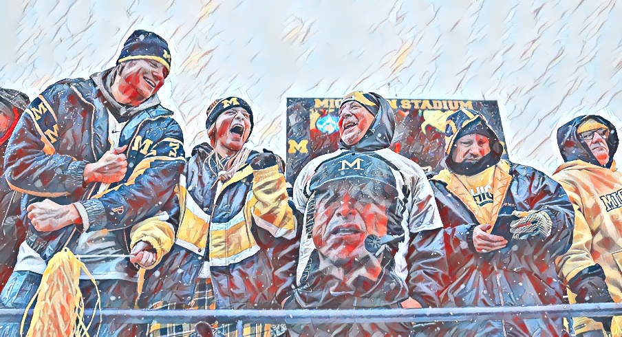 Michigan Wolverines cheer during the NCAA football game at Michigan Stadium in Ann Arbor on Sunday, Nov. 28, 2021.