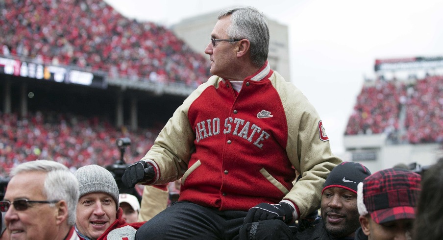 November 24, 2012; Columbus, OH, USA; Ohio State Buckeyes former coach Jim Tressel is held by players from his 2002 National Championship team in a game against the Michigan Wolverines at Ohio Stadium. Mandatory Credit: Greg Bartram-USA TODAY Sports
