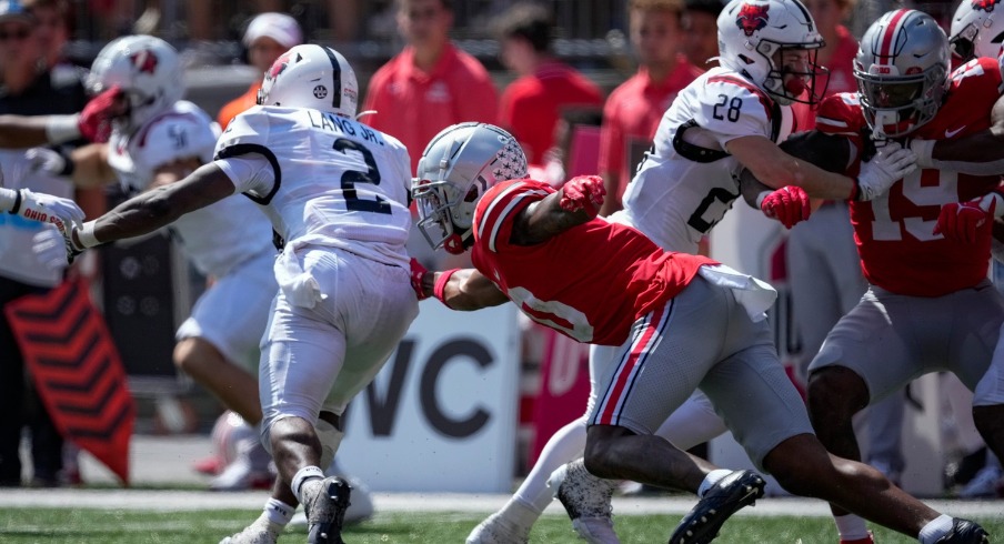 September 10, 2022; Columbus, Ohio, USA; Ohio State Buckeyes wide receiver Xavier Johnson (10) tackles Arkansas State Red Wolves running back Johnnie Lang (2) at Ohio State Buckeyes at Ohio Stadium. Mandatory Credit: Joseph Scheller-The Columbus Dispatch 