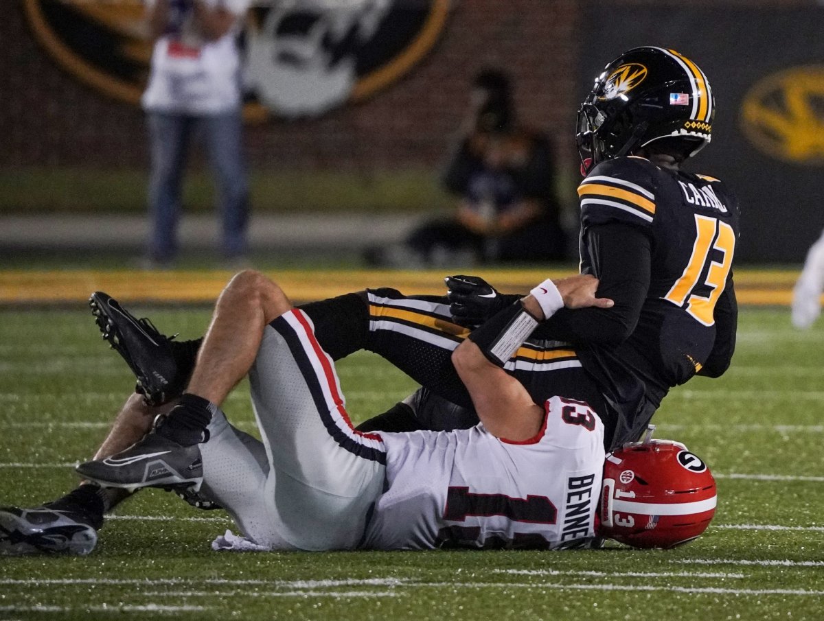 Oct 1, 2022; Columbia, Missouri, USA; Missouri Tigers defensive back Daylan Carnell (13) is tackled by Georgia Bulldogs quarterback Stetson Bennett (13) after Carnell s interception during the first half at Faurot Field at Memorial Stadium. Mandatory Credit: Denny Medley-USA TODAY Sports