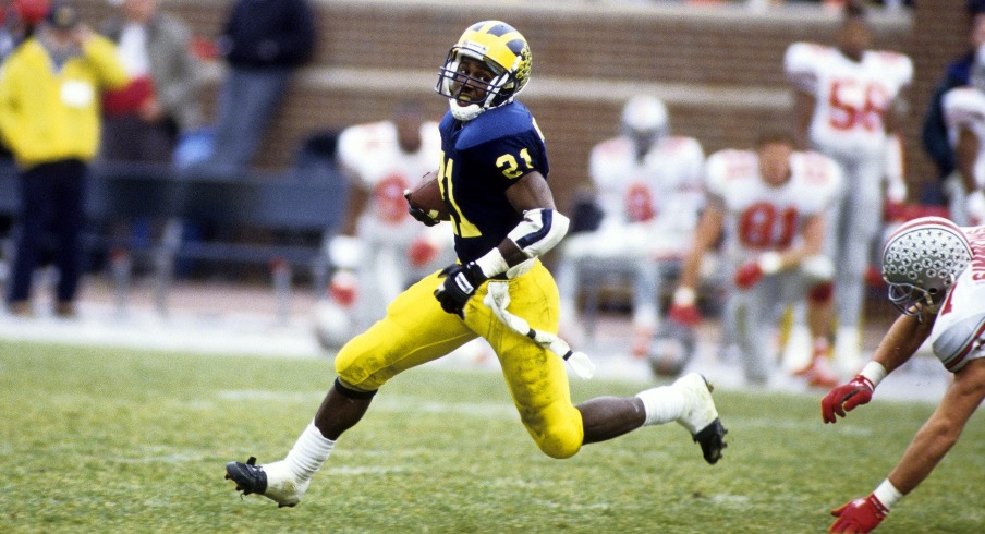 Nov 23, 1991; Ann Arbor, MI, USA; Michigan receiver Desmond Howard (21) returns a punt against the Ohio State Buckeyes at Michigan Stadium. Michigan defeated Ohio State 31-3. Mandatory Credit: USA TODAY Sports