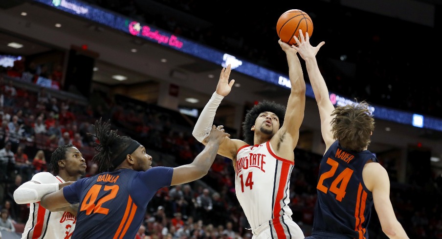 Feb 26, 2023; Columbus, Ohio, USA; Ohio State Buckeyes forward Justice Sueing (14) takes the shot over Illinois Fighting Illini forward Matthew Mayer (24) during the second half at Value City Arena. Mandatory Credit: Joseph Maiorana-USA TODAY Sports