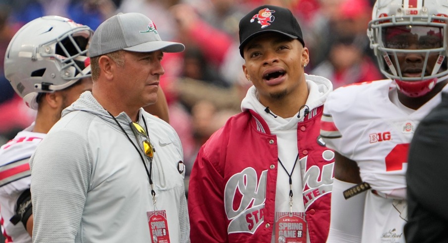 Apr 16, 2022; Columbus, Ohio, USA; Former Ohio State Buckeyes quarterbacks Kirk Herbstreit and Justin Fields talk during the spring football game at Ohio Stadium. Mandatory Credit: Adam Cairns-The Columbus Dispatch Ncaa Football Ohio State Spring Game