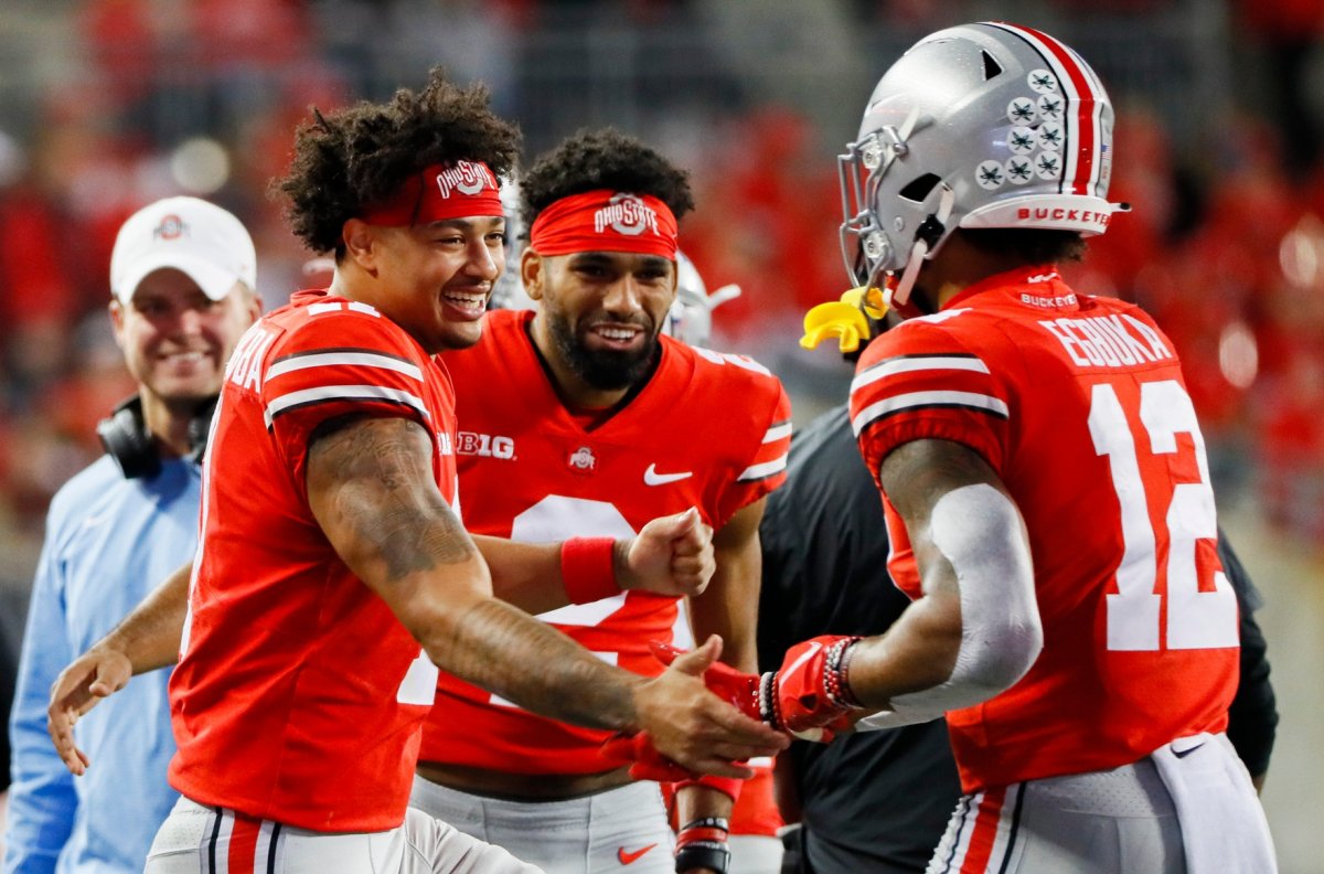 Ohio State Buckeyes wide receiver Jaxon Smith-Njigba (11) and Ohio State Buckeyes wide receiver Chris Olave (2) congratulate Ohio State Buckeyes wide receiver Emeka Egbuka (12) after a long run during the third quarter of a NCAA Division I football game between the Ohio State Buckeyes and the Akron Zips on Saturday, Sept. 25, 2021 at Ohio Stadium in Columbus, Ohio.