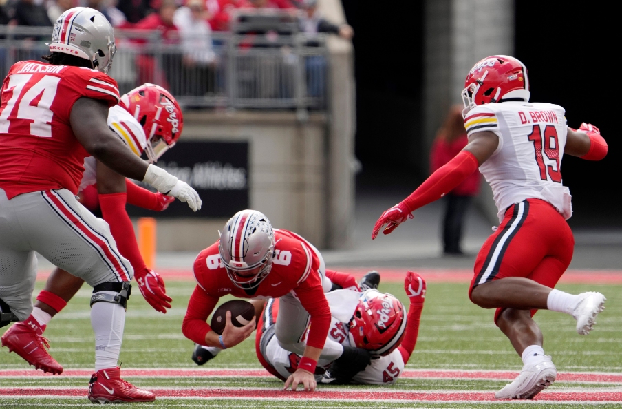 Oct. 7, 2023; Columbus, Oh., USA; Ohio State Buckeyes quarterback Kyle McCord (6) is tackled by Maryland Terrapins linebacker Kellan Wyatt (45) during the first half of Saturday's NCAA Division I football game at Ohio Stadium.