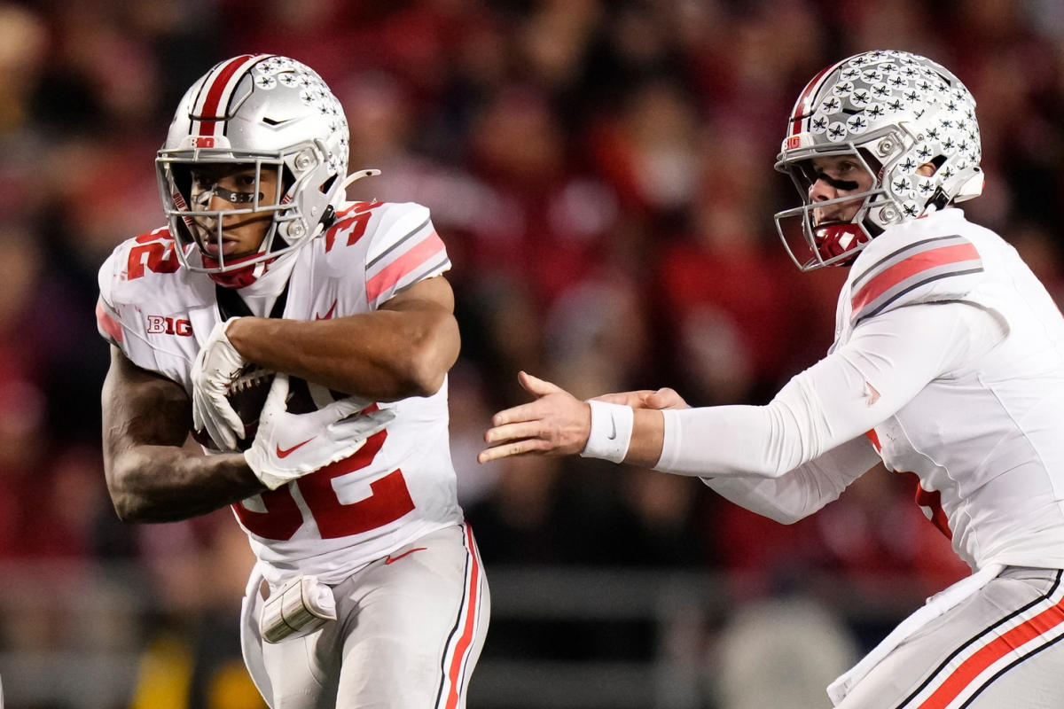Oct 28, 2023; Madison, Wisconsin, USA; Ohio State Buckeyes quarterback Kyle McCord (6) hands off to running back TreVeyon Henderson (32) during the second half of the NCAA football game against the Wisconsin Badgers at Camp Randall Stadium. Ohio State won 24-10.