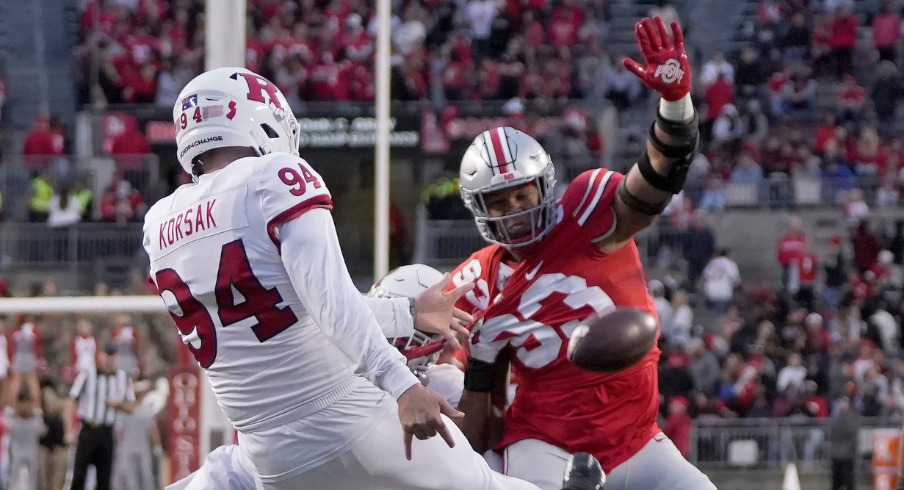 Oct. 1, 2022; Columbus, Ohio, USA; Ohio State Buckeyes defensive tackle Hero Kanu (93) tries to get a hand on a punt by Rutgers Scarlet Knights punter Adam Korsak (94) during the second half of Saturday's game in Columbus. Mandatory Credit: Barbara Perenic/Columbus Dispatch Sports Ohio State Rutgers Ncaa Football