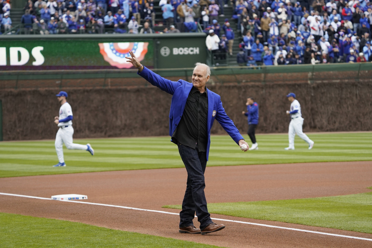 Apr 4, 2025; Chicago, Illinois, USA; Hall of Famer Ryne Sandberg throws out a ceremonial first pitch before the game between the Chicago Cubs and the San Diego Padres at Wrigley Field. Mandatory Credit: David Banks-Imagn Images