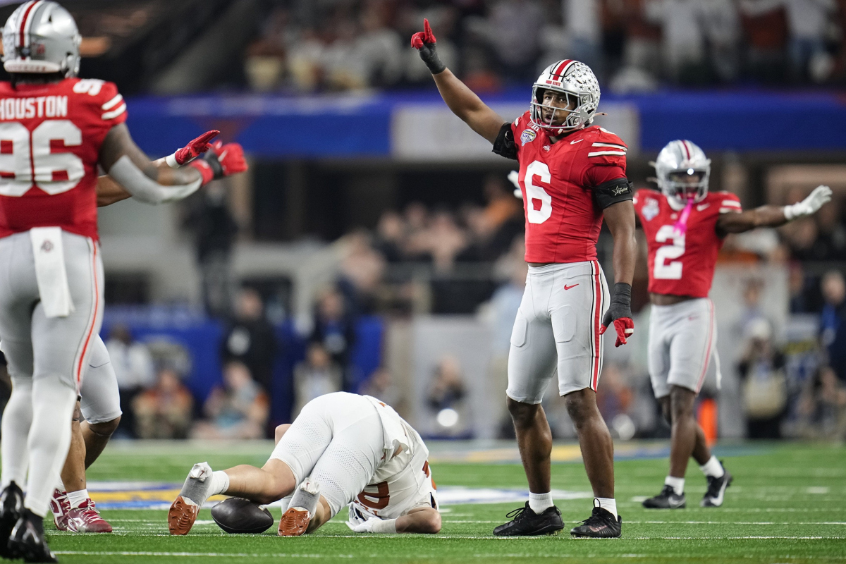 Ohio State Buckeyes safety Sonny Styles (6) celebrates a hit on Texas Longhorns tight end Gunnar Helm (85) during the first half of the Cotton Bowl Classic College Football Playoff semifinal game at AT&T Stadium in Arlington, Texas on Jan. 10, 2025.