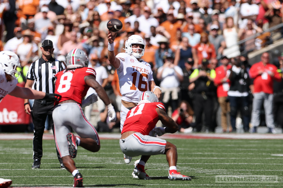 C.J. Hicks hits Arch Manning to force a short throw C.J. Hicks hits Arch Manning to force a short throw