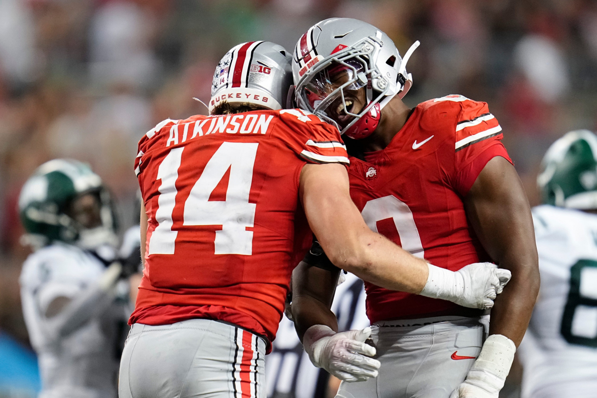 Ohio State Buckeyes defensive lineman Beau Atkinson (14) celebrates a sack of Ohio Bobcats quarterback Parker Navarro with linebacker Sonny Styles (0) during the second half of the NCAA football game at Ohio Stadium on Sept. 13, 2025. Ohio State won 37-9.