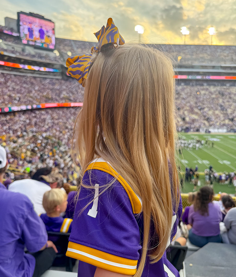 The author's daughter at an LSU game