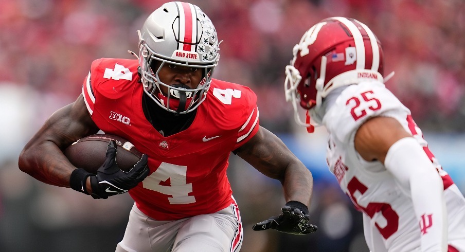 Ohio State Buckeyes wide receiver Jeremiah Smith (4) runs toward Indiana Hoosiers defensive back Amare Ferrell (25) during the second half of the NCAA football game at Ohio Stadium in Columbus on Saturday, Nov. 23, 2024. Ohio State won 38-15.