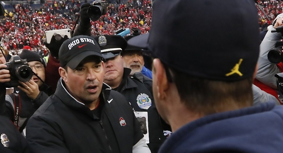 Ohio State Buckeyes head coach Ryan Day shakes hands with Michigan Wolverines head coach Jim Harbaugh following the NCAA football game at Michigan Stadium in Ann Arbor, Mich. on Saturday, Nov. 30, 2019. Ohio State won 56-27. [Adam Cairns/Dispatch]