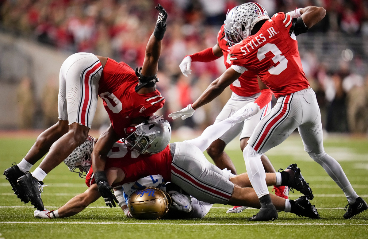Ohio State Buckeyes defensive end Caden Curry (92), linebacker Sonny Styles (0) and cornerback Lorenzo Styles Jr. (3) tackle UCLA Bruins wide receiver Mikey Matthews (7) during the NCAA football game at Ohio Stadium in Columbus on Nov. 15, 2025. Ohio State Buckeyes defensive end Caden Curry (92), linebacker Sonny Styles (0) and cornerback Lorenzo Styles Jr. (3) tackle UCLA Bruins wide receiver Mikey Matthews (7) during the NCAA football game at Ohio Stadium in Columbus on Nov. 15, 2025.