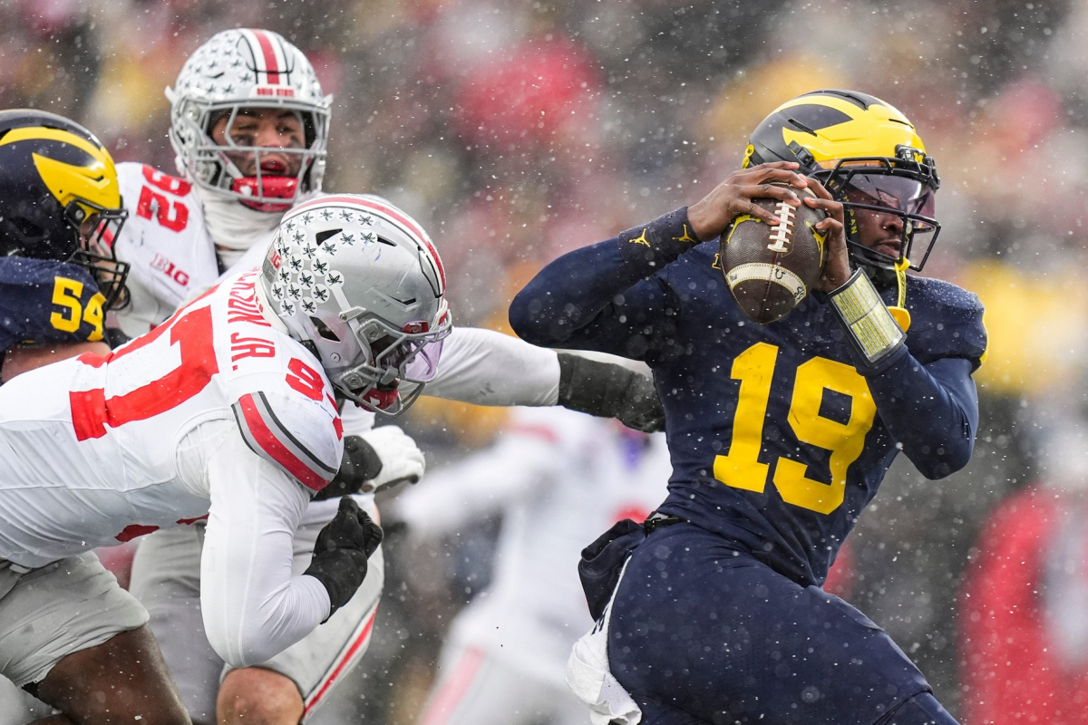 Michigan quarterback Bryce Underwood (19) is sacked by Ohio State defensive end Kenyatta Jackson Jr. (97) during the second half at Michigan Stadium in Ann Arbor on Saturday,