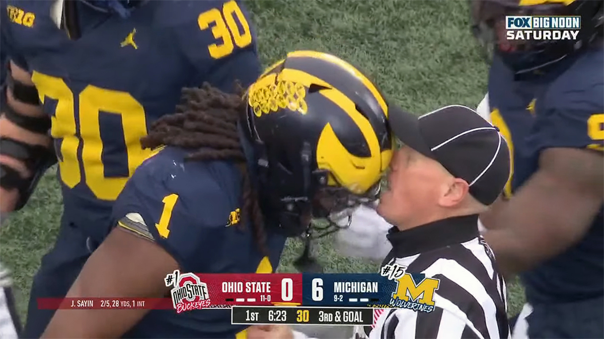 Michigan defender headbutting a referee