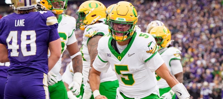 Dante Moore celebrating a touchdown vs. Washington Dante Moore celebrating a touchdown vs. Washington