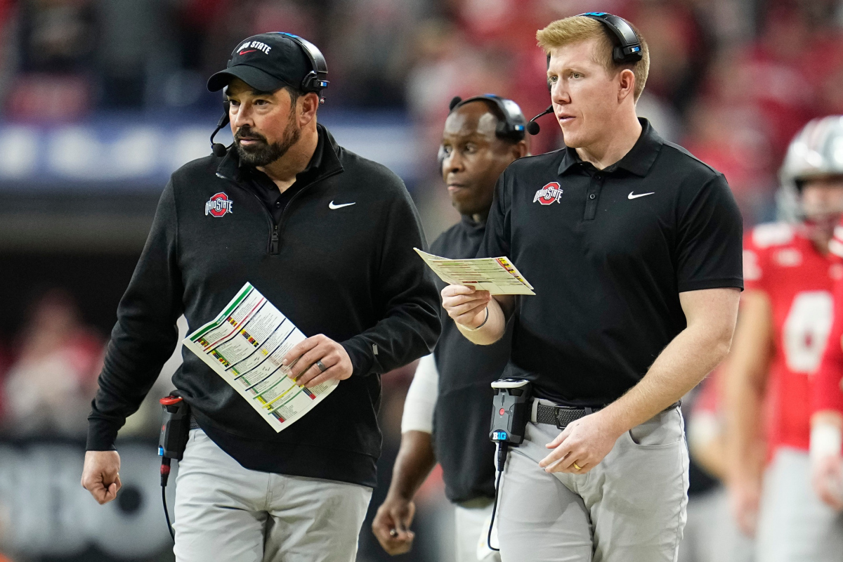 Ohio State Buckeyes tight ends coach Keenan Bailey, right, and head coach Ryan Day walk along the sideline during the Big Ten Conference championship game at Lucas Oil Stadium in Indianapolis on Dec. 6, 2025. Ohio State lost 13-10. Ohio State Buckeyes tight ends coach Keenan Bailey, right, and head coach Ryan Day walk along the sideline during the Big Ten Conference championship game at Lucas Oil Stadium in Indianapolis on Dec. 6, 2025. Ohio State lost 13-10.
