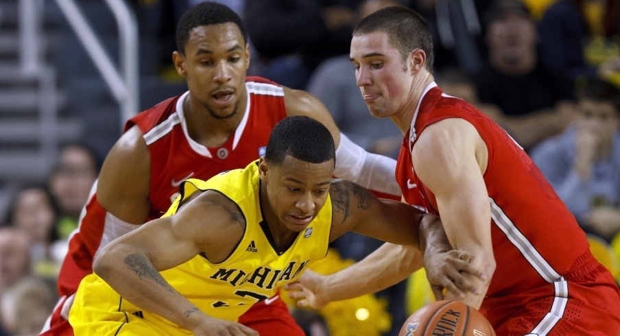 Feb. 18, 2012; Ann Arbor, MI, USA; Michigan Wolverines guard Trey Burke (3) is defended by Ohio State Buckeyes guard Aaron Craft (4) and forward Jared Sullinger (0) in the second half at Crisler Center. Mandatory Credit: Rick Osentoski-Imagn Images Feb. 18, 2012; Ann Arbor, MI, USA; Michigan Wolverines guard Trey Burke (3) is defended by Ohio State Buckeyes guard Aaron Craft (4) and forward Jared Sullinger (0) in the second half at Crisler Center. Mandatory Credit: Rick Osentoski-Imagn Images