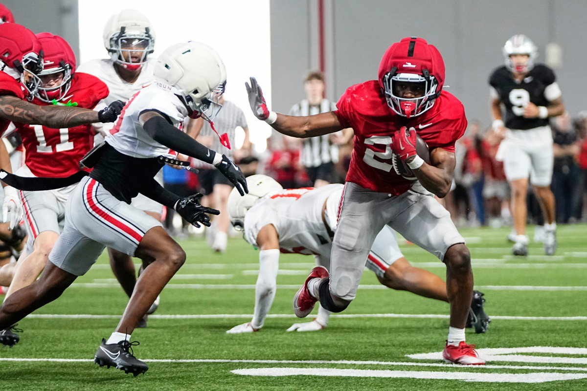 Ohio State Buckeyes running back Favour Akih (29) runs past cornerback Cam Calhoun (18) during Student Appreciation Day spring practice at the Woody Hayes Athletic Center on April 4, 2026.