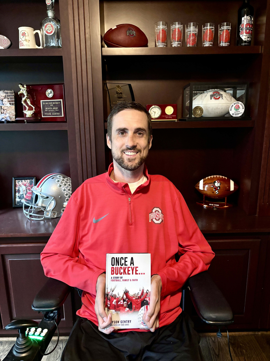 Tyson Gentry with his book, “Once A Buckeye…: A Story of Football, Family and Faith,” Tyson Gentry with his book, “Once A Buckeye…: A Story of Football, Family and Faith,”