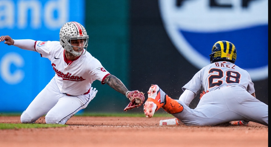 Detroit Tigers shortstop Javier Báez (28) takes second base against Cleveland Guardians second base Brayan Rocchio (4) during the seventh inning of Game 3 of AL wild-card series at Progressive Field in Cleveland on Thursday, Oct. 2, 2025.