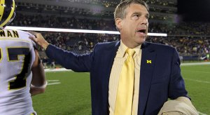 Dave Brandon, likely consoling a Michigan Man after a loss