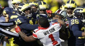 Dontre Wilson battles the entire Michigan Wolverine kickoff team.