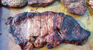 An Arkansas fan grilled a steak that looks like the Razorbacks' logo.