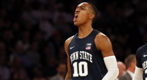 Tony Carr celebrates during Penn State's NIT championship game win over Utah.