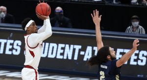 Jalen Tate shoots over Oral Roberts' Kareem Thompson