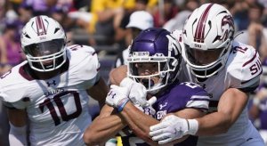 Sep 17, 2022; Evanston, Illinois, USA; Southern Illinois Salukis linebacker Branson Combs (12) tackles Northwestern Wildcats running back Evan Hull (26) during the first half at Ryan Field. Mandatory Credit: David Banks-USA TODAY Sports