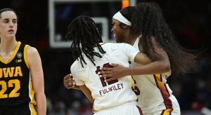 South Carolina players celebrate while Caitlin Clark looks on