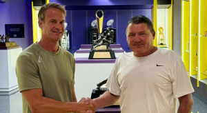Lane Kiffin and Ed Orgeron shaking hands