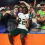 South Florida Bulls cornerback De'Shawn Rucker (22) celebrates with teammates after they beat the Florida Gators at Ben Hill Griffin Stadium.