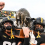 Iowa’s Jonah Pace and Bryce Hawthorne celebrate with the Floyd of Rosedale