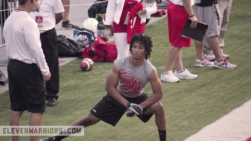 Erick Smith stretches at a Friday Night Lights camp in 2013.