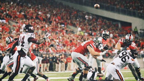 In this rare photo, J.T. Barrett has time to throw.