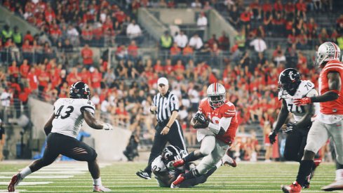 J.T. Barrett bosses up against Cincinnati.