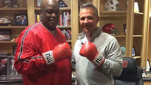 These two know how to throw them thangs, Urban Meyer and Buster Douglas